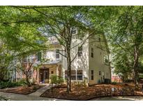 Charming two-story home with well-maintained lawn and mature trees offering shade at 1001 Dancing Fox Rd, Decatur, GA 30032