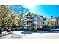 Exterior shot of a well-maintained condominium building with multiple balconies and assigned parking at 1315 Mcgill Park Ne Ave, Atlanta, GA 30312