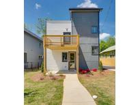 Contemporary two-story home with a balcony, neutral color scheme, and a well-manicured lawn at 76 Mayson Avenue Northeast Ne, Atlanta, GA 30307
