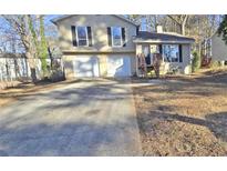 Split-level home with a two-car garage and a concrete driveway at 508 Jaywood Dr, Stone Mountain, GA 30083
