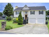 Charming two-story home with a well-manicured lawn and attached two-car garage at 8 Southview Dr, Cartersville, GA 30121