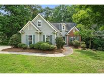 Charming home with a well-maintained lawn, offering inviting curb appeal and a cozy atmosphere at 46 Highland Ct, Carrollton, GA 30116