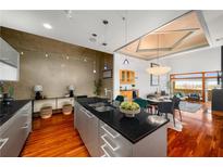 Modern kitchen featuring stainless steel appliances, granite countertops, and hardwood floors at 3334 Peachtree Ne Rd # 1707, Atlanta, GA 30326