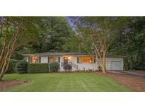 Charming one-story home with a well-manicured front yard and a quaint walkway leading to the front door at 3357 Pretty Branch Se Dr, Smyrna, GA 30080