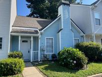 Charming exterior featuring light blue siding and a well-maintained front yard landscape at 5961 Sherwood Trce, Stonecrest, GA 30038