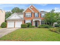 Charming two-story brick home featuring a well-manicured lawn and a two-car garage at 3616 Myrtlewood Nw Ct, Kennesaw, GA 30144