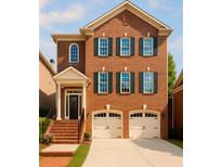 Charming two-story brick home with a two-car garage, classic windows, and a welcoming entrance at 2601 Canterbury Trl, Atlanta, GA 30324