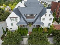 Stunning aerial view of this elegant home featuring a gray roof, white exterior, and meticulously landscaped surroundings at 201 Dovecrest Dr, Atlanta, GA 30305