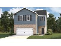 Charming two-story home with blue siding, brick accents, and a two-car garage at 5451 Baybrook Cir, South Fulton, GA 30349