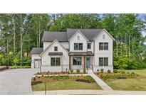 New construction two-story home with Hardie siding, gray roof and landscaped yard at 2545 Bertrand Way, Cumming, GA 30041