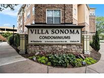 Villa Sonoma Condominiums sign with professional landscaping and stone facade at 10 Perimeter Summit Ne Blvd # 4223, Brookhaven, GA 30319