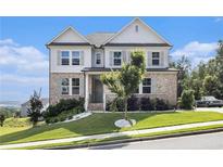 Charming two-story home with a brick and siding exterior, landscaped yard, and inviting front porch at 25 Running Terrace Way, Cartersville, GA 30121