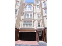 Charming townhouse with brick accents, large windows, and an attached garage at 3541 Roswell Ne Rd # 20, Atlanta, GA 30305