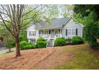 Charming home with gray siding, black shutters, and a welcoming front porch at 350 Spring View Ct, Dallas, GA 30157