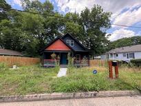 Charming single-Gathering home with a well-maintained front yard and mature trees at 1149 Tucker Sw Pl, Atlanta, GA 30310