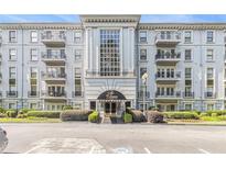 Beautiful condominium complex featuring a well maintained facade and manicured landscaping at 3201 Lenox Ne Rd # 23, Atlanta, GA 30324