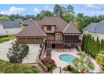 Beautiful brick home with a pool, screened in porch, and three car garage at 3410 Enclave Mill Ct, Dacula, GA 30019