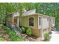 Stunning home with meticulous landscaping and a welcoming entrance at 970 Pine Grove Pointe Dr, Roswell, GA 30075