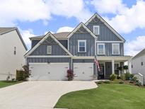 Charming two-story home with a two-car garage, landscaped yard, and welcoming front porch at 244 Citrine Way, Acworth, GA 30101