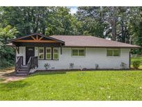 Charming, newly renovated one-story home with a welcoming front porch and landscaped yard at 1769 W Austin Rd, Decatur, GA 30032