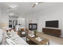 Bright living room featuring a modern fireplace and contemporary furnishings at 401 16Th Nw St # 1357, Atlanta, GA 30363
