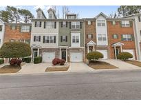 Charming townhome exteriors featuring stone accents and manicured landscaping for curb appeal at 3044 Lauren Parc Rd, Decatur, GA 30032