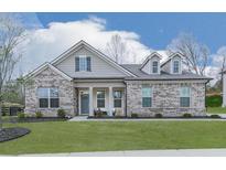 Charming single-story brick home with well-manicured lawn and inviting front porch at 449 Carmichael Cir, Canton, GA 30115