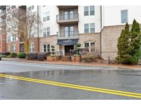 Apartment building exterior with awnings, professional landscaping, and manicured shrubbery at 901 Abernathy Ne Rd # 5140, Sandy Springs, GA 30328