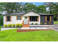 Charming single-story home with a well-manicured lawn, and freshly painted exterior at 1326 Stella Sw Cir, Mableton, GA 30126