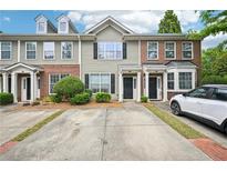 Charming townhome features well-maintained landscaping and private driveways at 2084 Del Lago Nw Cir # 1, Kennesaw, GA 30152