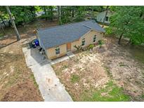 Charming single-story brick home featuring a new roof and front yard at 6010 Fieldcrest Dr, Morrow, GA 30260