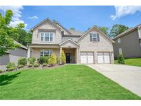 Beautiful two-story brick home featuring manicured landscaping and a two car garage at 622 Denali Dr, Mableton, GA 30126