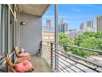 City view from balcony with two chairs and gray exterior walls at 171 Auburn Ne Ave # 521, Atlanta, GA 30303