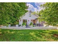 Charming cottage-style home with a beautifully landscaped front yard and inviting outdoor patio at 439 Atlanta Se Ave, Atlanta, GA 30315