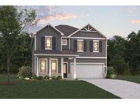 Charming two-story home featuring gray siding, black shutters, and a well-manicured front lawn at 2625 Mourning Dove Dr (Lot 47), Grayson, GA 30017