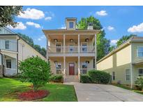 Charming two-story home featuring a double front porch, well-manicured lawn, and inviting curb appeal at 2817 Lincoln Dr, Decatur, GA 30033