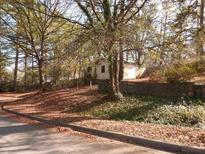Cozy home nestled among the trees with a quaint and private yard setting at 2117 Samuel Place Pl, Decatur, GA 30032