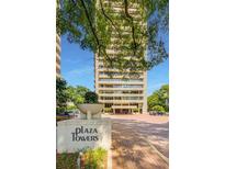 Exterior shot of Plaza Towers condominium building entrance and landscaping at 2575 Peachtree Ne Rd # 15F, Atlanta, GA 30305