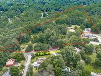 Expansive aerial view of the property at 2750 Hembree Rd, showing the landscape and surrounding areas at 2760 Hembree Ne Rd, Marietta, GA 30062