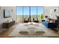 Bright living room with floor-to-ceiling windows and contemporary furnishings at 2575 Peachtree Ne Rd # 15G, Atlanta, GA 30305