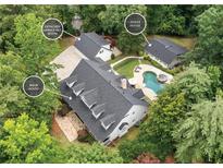 Stunning aerial view of estate with pool, guest house and detached garage/recreation room at 1824 Mount Paran Nw Rd, Atlanta, GA 30327