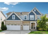 Beautiful two-story home with a two-car garage and a well-manicured lawn at 1820 Primrose Park Rd, Sugar Hill, GA 30518