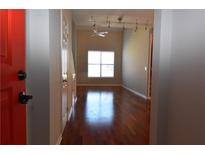 Bright living room features hardwood floors and modern track lighting fixtures at 400 17Th Nw St # 2412, Atlanta, GA 30363