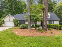 Charming single-Gathering home with a well-manicured lawn and mature trees in a peaceful neighborhood at 229 Devonwood Dr, Atlanta, GA 30328