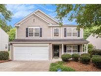 Charming two-story home featuring a well-maintained front yard and attached garage at 6738 Brookfield Way, Douglasville, GA 30134