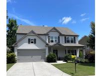 Charming two-story home boasts a well-manicured lawn and inviting curb appeal, perfect for Gathering living at 110 Serendipity Way, Dallas, GA 30157