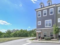 Stylish townhome featuring multi-tone exterior and inviting architectural details at 2140 Colvin Nw Ct, Atlanta, GA 30318