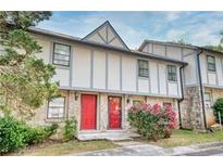 Charming townhome with stone accents, red doors, and beautiful landscaping at , Stone Mountain, GA 30083