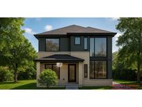 Modern two-story home featuring large windows and a well-manicured front lawn at 1111 Moreland Se Pl, Atlanta, GA 30316