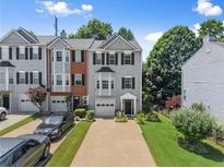 Charming townhome with well-maintained landscaping and a private driveway, offering curb appeal at 1628 Indian Way, Cumming, GA 30040